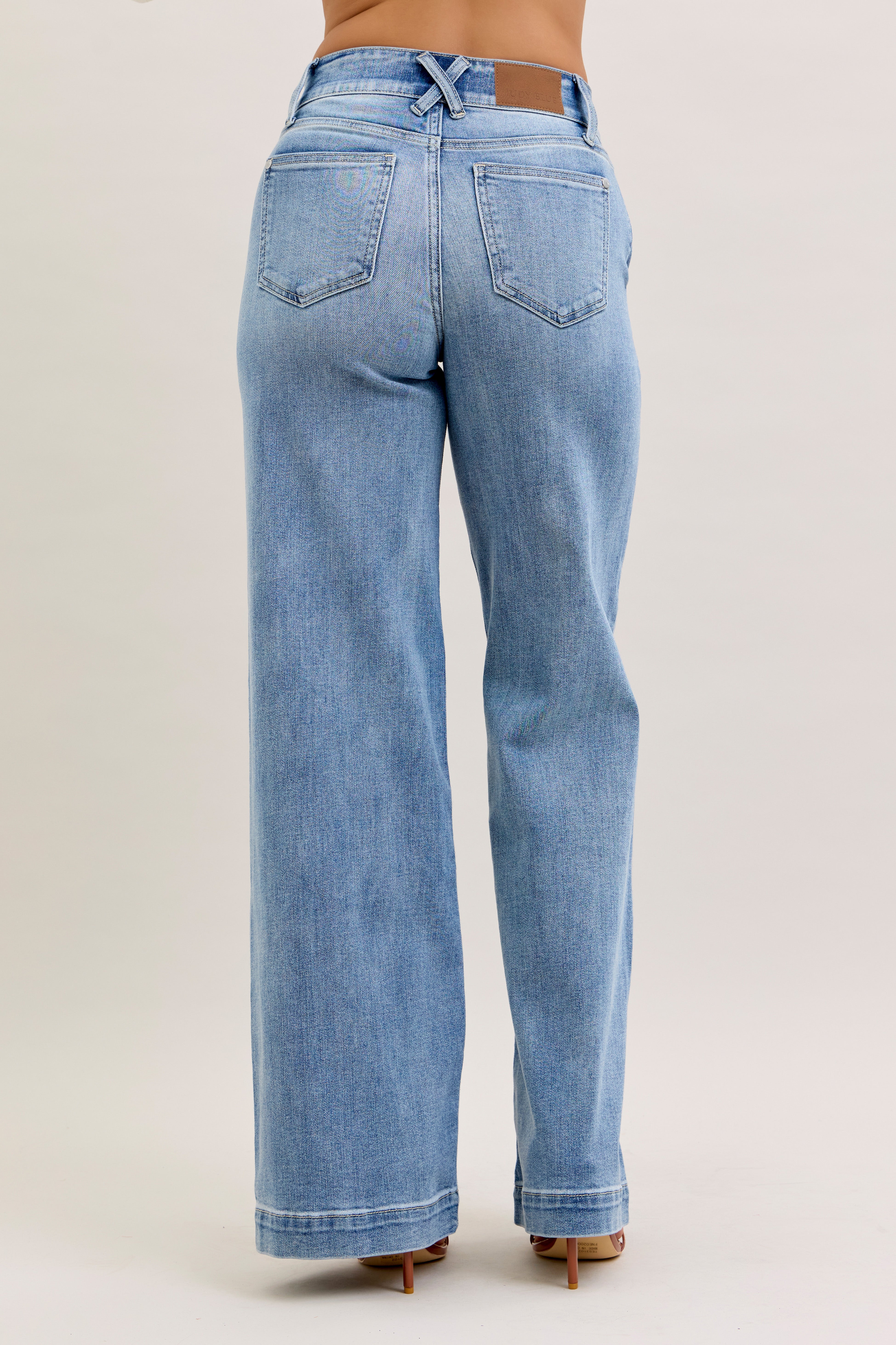 Light blue jeans on a plain background