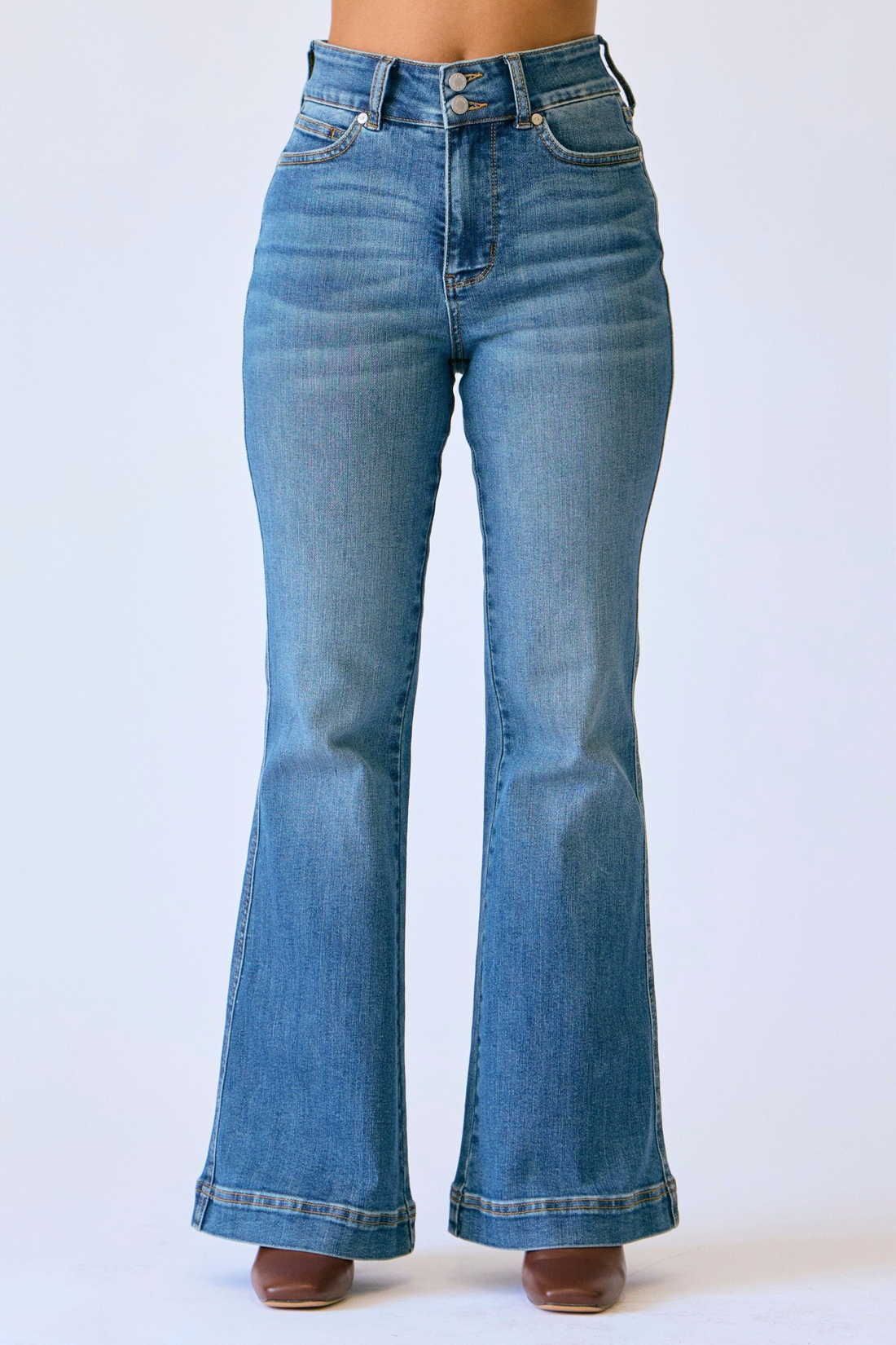 Blue flared jeans on a white background