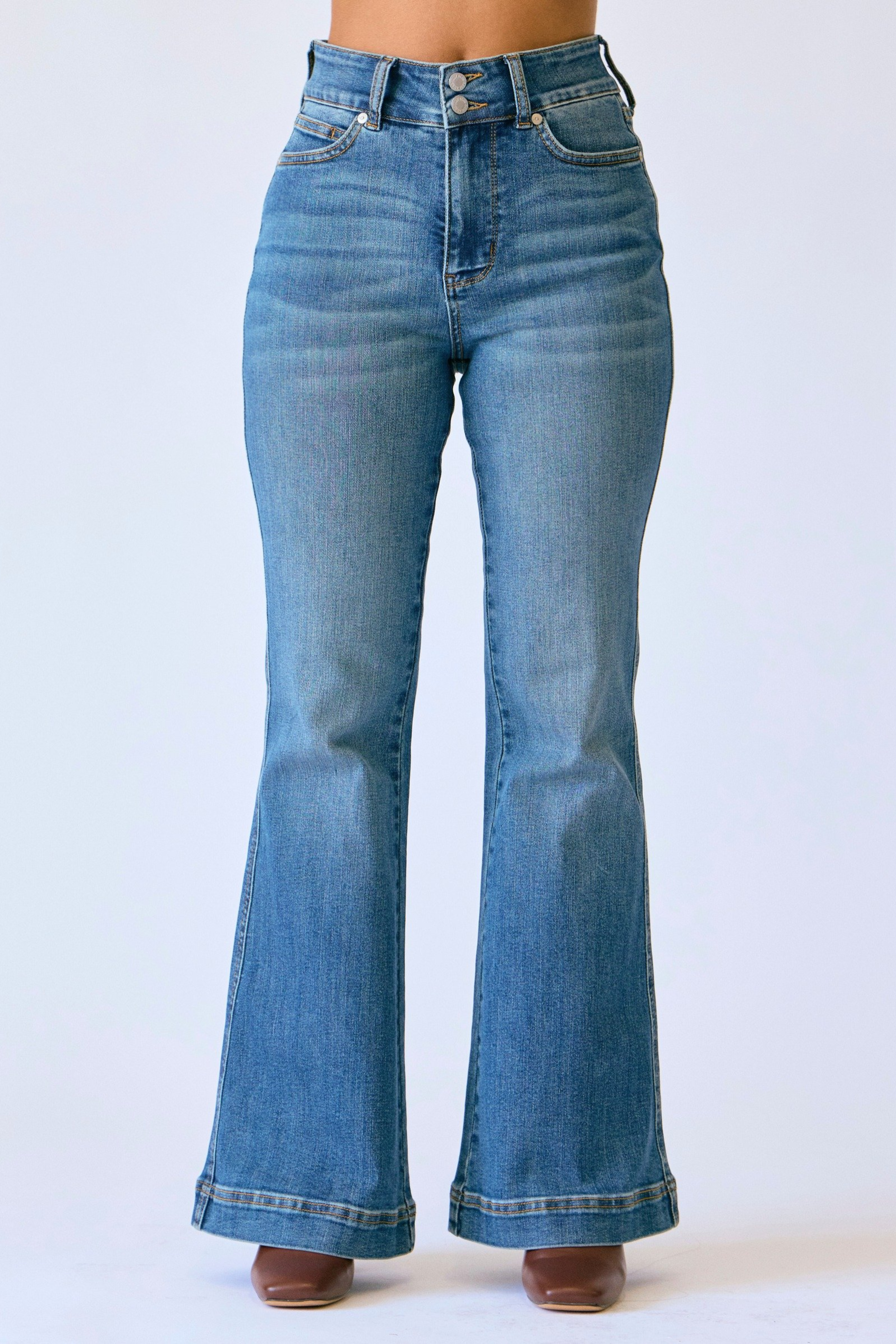 Blue flared jeans on a white background